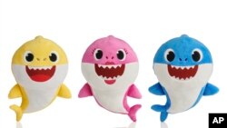 This picture shows the WowWee pinkfong Baby Shark family of singing plush toys. The viral song and its kiddie music videos have entranced toddlers and parents alike, though some of the grown-ups are now suffering from shark fatigue. (AP Photo/WowWee)