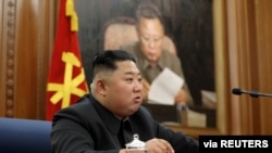North Korean leader Kim Jong Un speaks during the Third Enlarged Meeting of the Seventh Central Military Commission of the Workers' Party of Korea in this undated photo released Dec. 22, 2019, by North Korea's Korean Central News Agency.