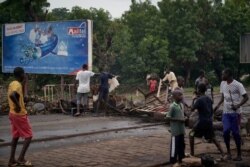 Protesters build barricades to block circulation on the Martyrs Bridge of Bamako, Mali, July 11, 2020.