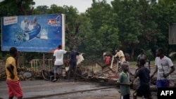 Protesters build barricades to block circulation on the Martyrs Bridge of Bamako, Mali, July 11, 2020. 