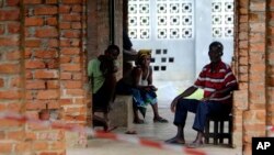 People suspected of having the Ebola virus wait at a treatment center in Bikoro, Democratic Republic of Congo, May 13, 2018. Congo's latest Ebola outbreak has spread to a city of more than 1 million people, a worrying shift as the deadly virus risks traveling more easily in densely populated areas.