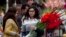 People buy flowers at a flower market, to celebrate Valentine's Day, in Islamabad, Pakistan, Tuesday, Feb. 14, 2017.