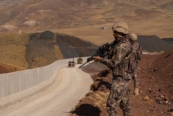 Soldiers patrol the Turkish-Iranian border trying to prevent Afghans refugees from entering Turkey, on Aug. 30, 2021. (VOA/Yan Boechat)