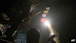 The USS Ross (DDG 71) fires a tomahawk land attack missile Friday from the Mediterranean Sea, April 7, 2017.