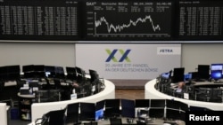 FILE - The German share price index DAX graph is pictured at the stock exchange in Frankfurt, Germany, April 8, 2020. 