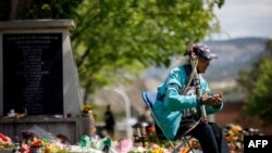 Kamloops Indian Residential School survivor Stanley Paul, 76, sits by a makeshift memorial at the former residential school to honour the 215 children whose remains were discovered buried near the facility, in Kamloops, Canada, June 4, 2021. 