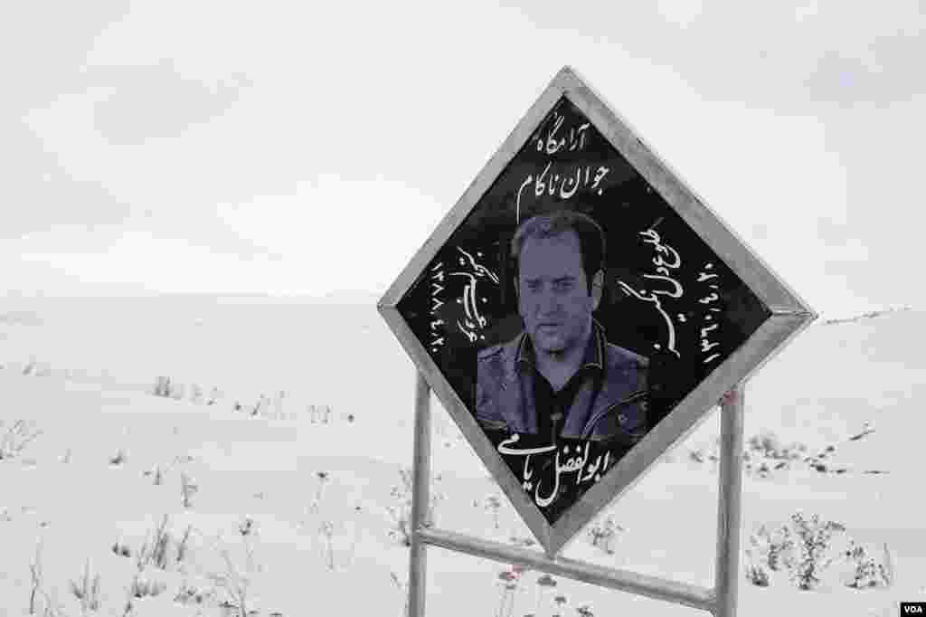 A memorial sign for an Iranian trucker who missed a curve on Armenia's main road link to Iran, Feb. 21, 2013. (V. Undritz/VOA)