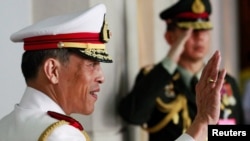 FILE - Thailand's Crown Prince Maha Vajiralongkorn waves to well-wishers who had gathered to see King Bhumibol Adulyadej before he departed to the Grand Palace from Siriraj Hospital to take part in his coronation anniversary ceremonies in Bangkok, Thailand May 5, 2010. 