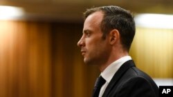 FILE - Oscar Pistorius pauses in the dock at the High Court in Pretoria, South Africa, Dec. 8, 2015. The denial of his appeal clears the way for a judge to sentence Pistorius on his murder conviction at a hearing set for April 18.