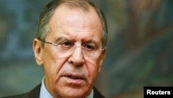 Russian Foreign Minister Sergei Lavrov speaks to reporters after a meeting with his Saudi Arabian counterpart, Saud al-Faisal, in Moscow, Nov. 21, 2014.