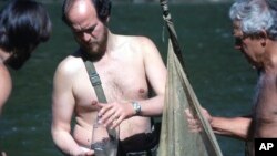 This April 1978 photo provided via courtesy of C. Kenneth Dodd Jr. shows Glenn Clemmer, Jim Williams, center, and Royal Suttkus conducting fish surveys along the Cahaba River in Alabama. (Courtesy of C. Kenneth Dodd Jr. via AP)