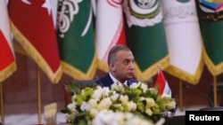 FILE: Iraqi Prime Minister Mustafa al-Kadhimi attends a summit meeting in Baghdad, Iraq, August 28, 2021.