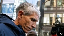 FILE - William "Rick" Singer founder of the Edge College & Career Network, departs federal court in Boston after pleading guilty to charges in a nationwide college admissions bribery scandal, March 12, 2019.