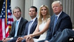 FILE - From left, Eric, Donald Jr. and Ivanka Trump — shown with their father at a groundbreaking ceremony for the Trump International Hotel in Washington, July 23, 2014 — are among those scheduled to speak at the 2016 Republican National Convention.
