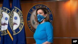Speaker of the House Nancy Pelosi, D-Calif., pauses as she meets with reporters on Capitol Hill in Washington, Nov. 12, 2020.