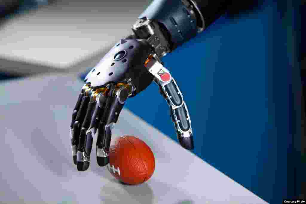 Survivors sit in front of their tents near the site of the landslide that killed hundreds of people. Authorities are trying to help the 700 families displaced by the torrent of mud that swept through their village, in Badakhshan province, northeastern Afghanistan, May 6, 2014.