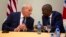 U.S. Homeland Security Secretary John Kelly, left, talks to Haiti's President Jovenel Moise during a news conference at the National Palace in Port-au-Prince, May 31, 2017. 