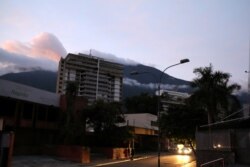 People walk on the street during a blackout in Caracas, Venezuela, July 22, 2019.