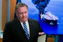 Secretary of State Mike Pompeo closes his remarks as he departs after a media availability, at the State Department, June 13, 2019.