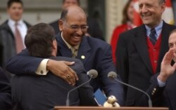 Maryland Lt. Governor Michael Steele embraces Gov. Robert Ehrlich at a rally on April 25, 2003, on the steps of the Statehouse in Annapolis, Md.