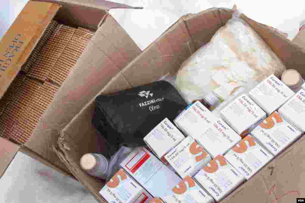 A small team of doctors was tasked with visiting those refugees most in need, and brought with them not just medicine but biscuits, too - in the fight against illness, good nutrition is crucial. (John Owens/VOA News)