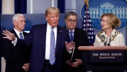 President Donald Trump gestures as he asks a question to Dr. Deborah Birx, White House coronavirus response coordinator, during a briefing about the coronavirus in the James Brady Briefing Room, March 23, 2020, in Washington.