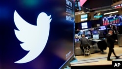 FILE - The logo for Twitter is displayed above a trading post on the floor of the New York Stock Exchange on Feb. 8, 2018. 