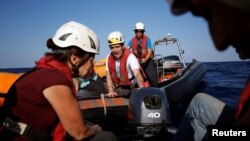 Aid workers from the aid group Sea-Watch carry out training drills off the coast of Malta in preparation for a mission in the Mediterranean to search for migrants attempting to reach Europe by boat from the Libyan coast, Nov. 2, 2016.