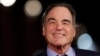 FILE - Director Oliver Stone arrives for the screening of his movie "Snowden," at the Rome Film Festival, in Rome. Showtime aired a series of interviews between Stone and Russian President Vladimir Putin over four days in June 2017.