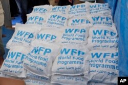 FILE - Food parcels provided by the World Food Program are stacked at the Reyhanli border crossing with Syria, near Hatay, Turkey, on May 24, 2017. The U.N. reports that in September 2024, 3 in every 4 people in Syria need humanitarian assistance.
