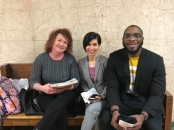 Attorney Gina Chiala (ctr) in court with a tenant (right) and an intern, Kansas City, Missouri. (Photo: courtesy HCJF)