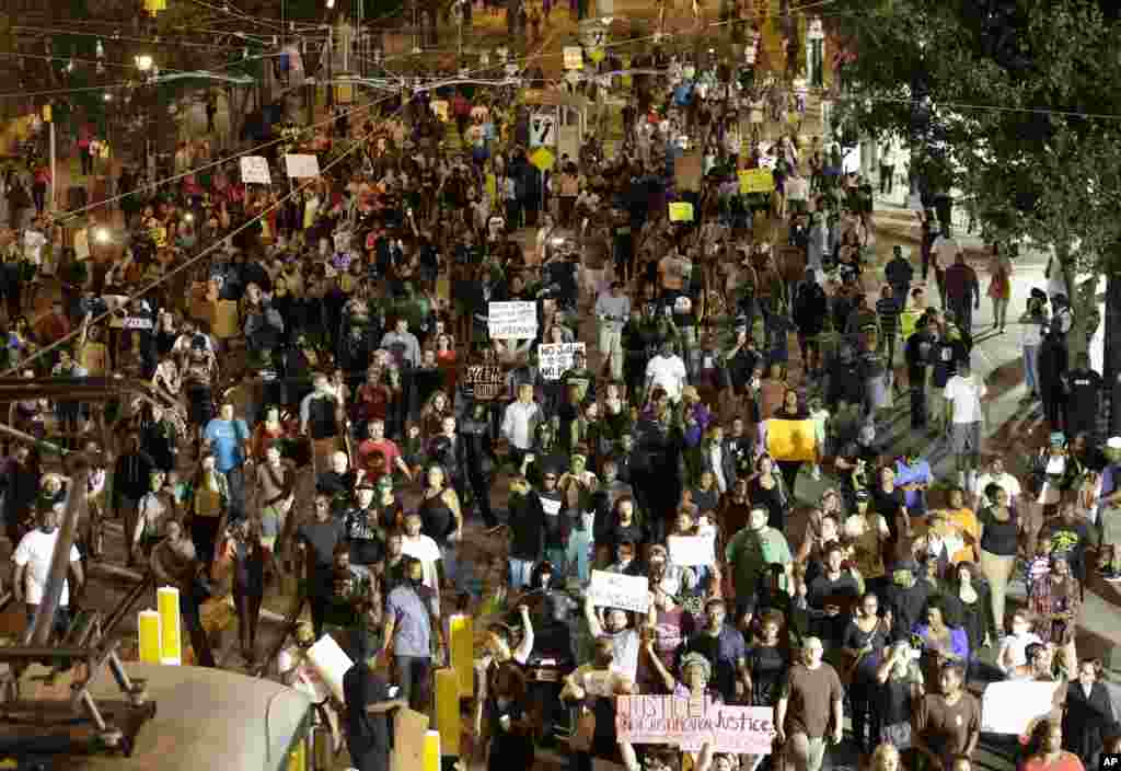Demonstrators protest Tuesday's fatal police shooting of Keith Lamont Scott in Charlotte, N.C., Sept. 21, 2016. 