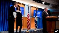 Secretary of State Mike Pompeo, right, accompanied by special representative on Iran Brian Hook, left, and spokeswoman Morgan Ortagus, speaks at a news conference at the State Department, Nov. 18, 2019.