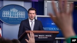 White House Press Secretary Josh Earnest speaks during the daily briefing at the White House in Washington, March 9, 2015.