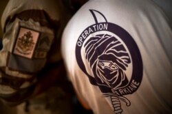 FILE- In this June 9, 2021 file photo, French Barkhane force soldiers who wrapped up a four-month tour of duty in the Sahel leave their base in Gao, Mali.