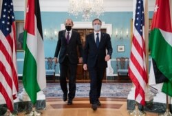 US Secretary of State Antony Blinken (R) and Jordanian Foreign Minister Ayman Safadi (L) arrive to speak the media prior to a meeting at the State Department in Washington, May 10, 2021.