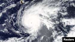 Hurricane Lane, upgraded to a Category 5 storm, is pictured approaching Hawaii, U.S. in this Aug. 21, 2018 NASA handout satellite photo.