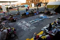 A memorial at the place where George Floyd died is seen while the city of Minneapolis enters its third day of the trial of Derek Chauvin, in Minneapolis, Minnesota, March 31, 2021.