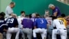 Father Pat Conroy, Chaplain of the House of Representatives, leads members of the Republican and Democratic Congressional baseball teams in prayer prior to the Congressional Baseball Game at Nationals Park in Washington, June 15, 2017. 