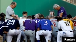 Father Pat Conroy, Chaplain of the House of Representatives, leads members of the Republican and Democratic Congressional baseball teams in prayer prior to the Congressional Baseball Game at Nationals Park in Washington, June 15, 2017. 