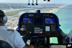 The cockpit of the Goodyear Blimp is scene during a flight, Wednesday, Feb. 12, 2025, in Daytona Beach, Fla. (AP Photo/Mark Long)
