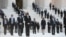 People wait for the casket of the late Supreme Court Justice Ruth Bader Ginsburg to arrive at the U.S. Supreme Court in Washington.