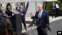 President Donald Trump talks to the media at the White House as he leaves for Dallas to address the National Rifle Association, May 4, 2018 in Washington. 
