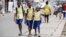 FILE - Schoolchildren walk in the street in Lagos, Nigeria, June 17, 2014. 