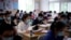 Students wearing face masks are seen inside a classroom during a government-organised media tour at a high school as more students returned to campus following the coronavirus disease (COVID-19) outbreak, in Shanghai, China May 7, 2020. REUTERS/Aly Song