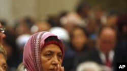Christian pilgrim prays during the Christmas midnight Mass at the Church of the Nativity, traditionally believed to be the birthplace of Jesus Christ, in the West Bank town of Bethlehem early Sunday, Dec. 25, 2011.