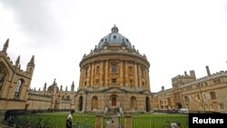 FILE - A man walks in front of the buildings of Oxford University, amid the spread of the coronavirus disease (COVID-19) in Oxford, Britain, Oct. 6, 2020.