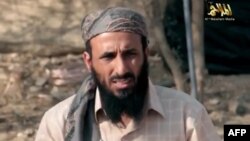 FILE - AQAP chief Nasir al-Wuhayshi allegedly addressing scores of jihadists at an undisclosed location in Yemen.