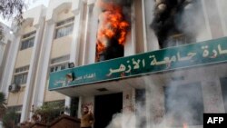 A man stands outside a faculty building at Cairo's Al-Azhar University after students stormed it on December 28, 2013.