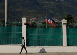 The Haitian flag flies at half-staff at the Presidential Palace in Port-au-Prince, Haiti, July 10, 2021, three days after President Jovenel Moise was assassinated in his home.